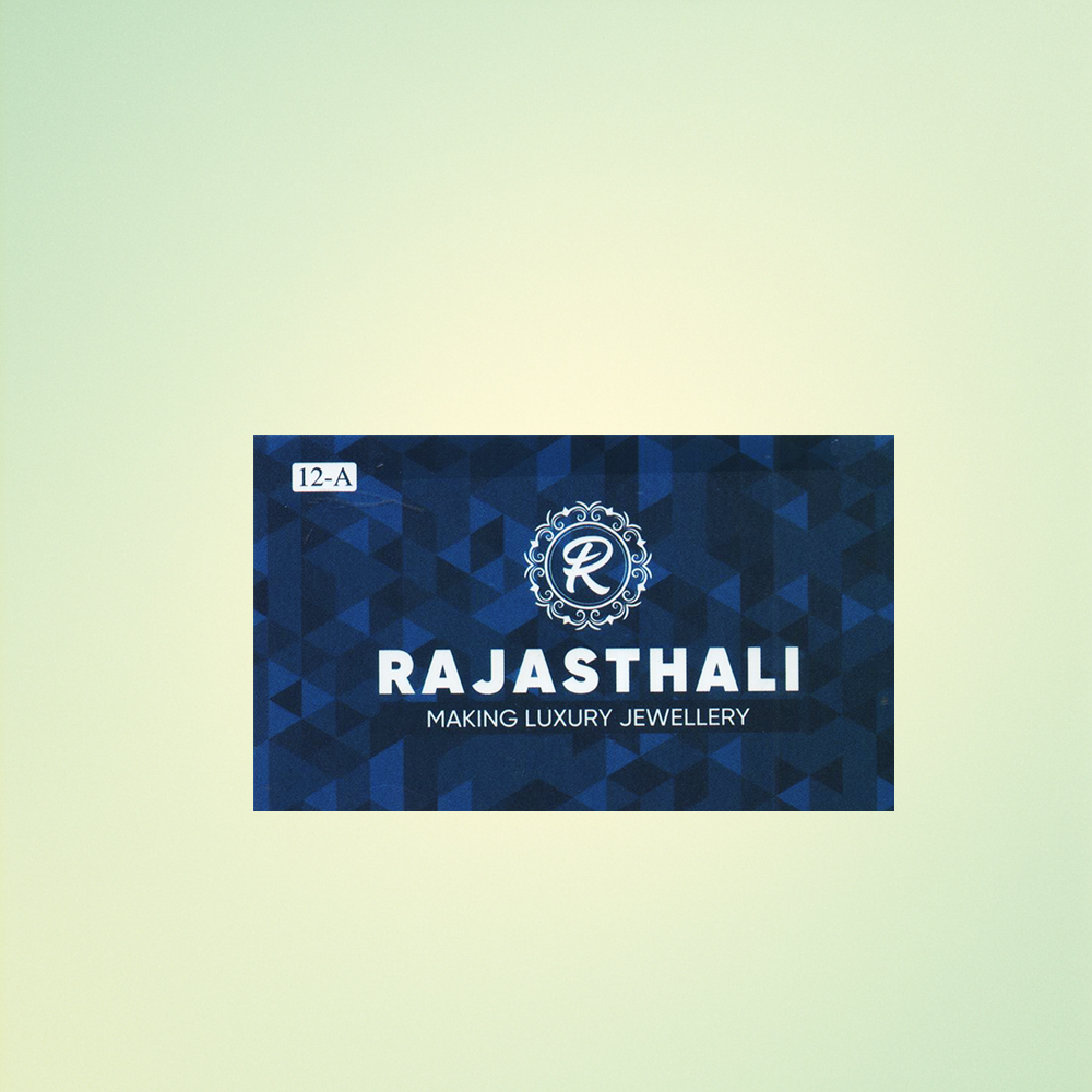 "Visiting card design for Aishwarya Jewellers with turquoise theme, floral elements, model image, and business details."